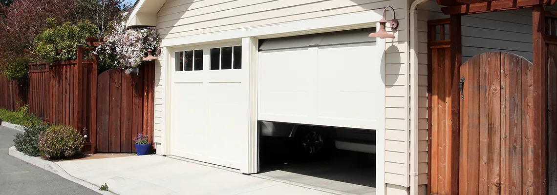 Fix Metal Garage Door Jerking in Moline, Illinois